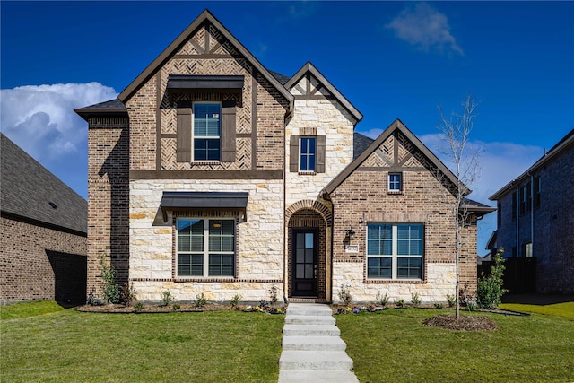 16532 Dunkirk Ln, Frisco, TX 75035 - view of front of property featuring a front yard, brick siding, and stone siding