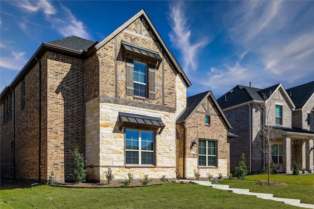 16532 Dunkirk Ln, Frisco, TX 75035 - view of front of house with a front lawn, brick siding, and stone siding