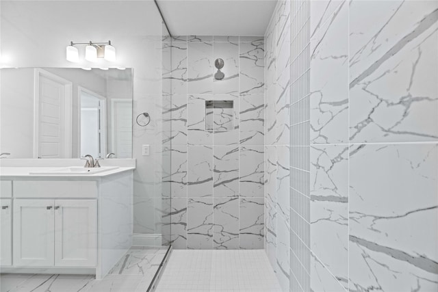 16532 Dunkirk Ln, Frisco, TX 75035 - bathroom featuring tiled shower, marble look tile flooring, and vanity