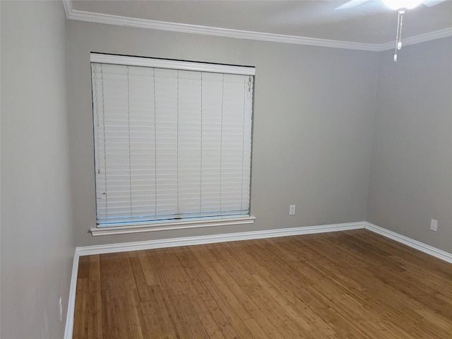 7525 Holly Hill Dr Unit 68, Dallas, TX 75231 - spare room with wood finished floors, baseboards, crown molding, and ceiling fan