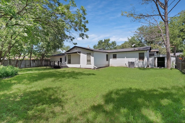 6928 Glen Hills Rd, Richland Hills, TX 76118 - rear view of house with central air condition unit and a wooden deck