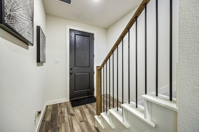 2734 Levee Ln, Lewisville, TX 75067 - entryway with wood finished floors, stairway, and baseboards