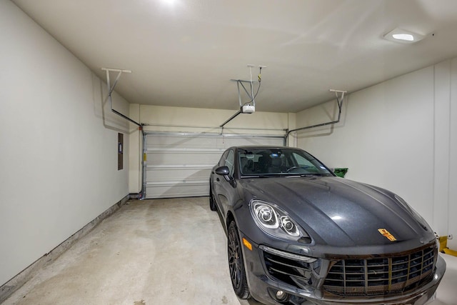2734 Levee Ln, Lewisville, TX 75067 - garage with a garage door opener and baseboards