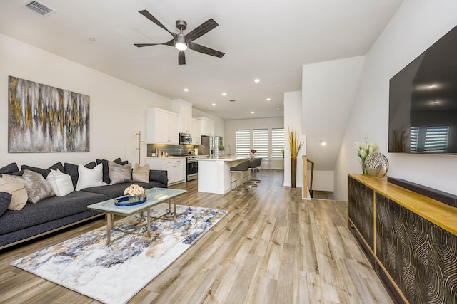 2734 Levee Ln, Lewisville, TX 75067 - living room with light wood-type flooring, a ceiling fan, and recessed lighting
