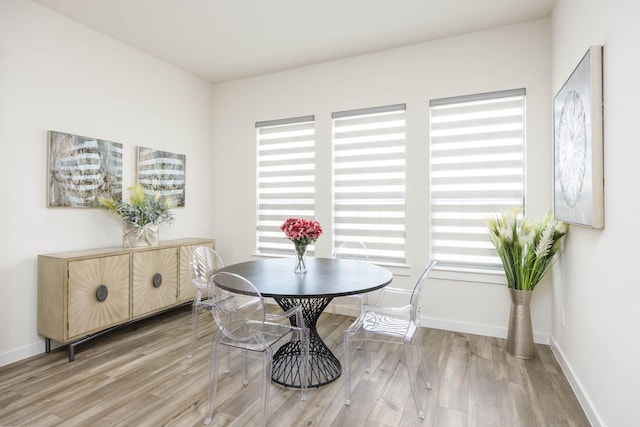 2734 Levee Ln, Lewisville, TX 75067 - dining space featuring light wood-style floors and baseboards