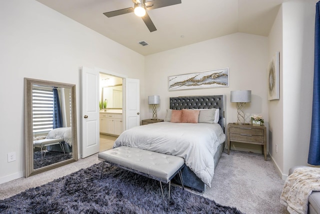 2734 Levee Ln, Lewisville, TX 75067 - bedroom with lofted ceiling, light colored carpet, baseboards, ensuite bathroom, and a ceiling fan
