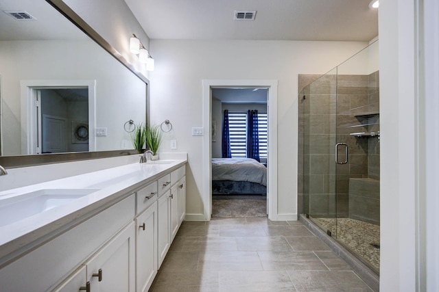 2734 Levee Ln, Lewisville, TX 75067 - full bath featuring double vanity, a stall shower, baseboards, ensuite bath, and tile patterned floors