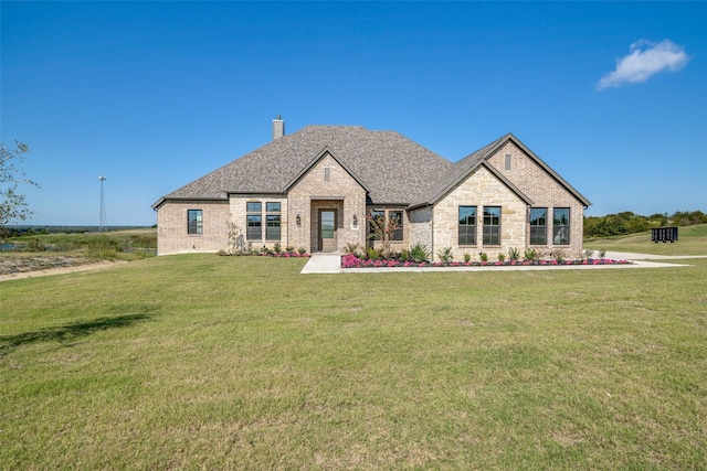 9900 Aiken Ct, Mesquite, TX 75126 - french country inspired facade featuring a chimney, a front lawn, and brick siding
