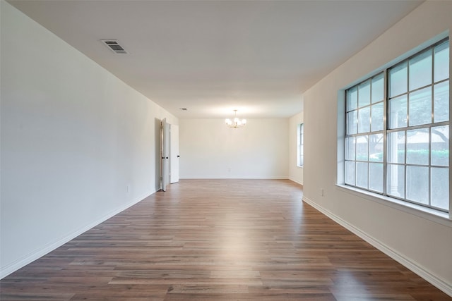 4313 Barcelona Dr, Fort Worth, TX 76133 - spare room with a chandelier, wood finished floors, and baseboards