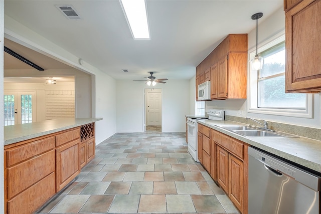 4313 Barcelona Dr, Fort Worth, TX 76133 - kitchen featuring white appliances, a sink, light countertops, pendant lighting, and ceiling fan