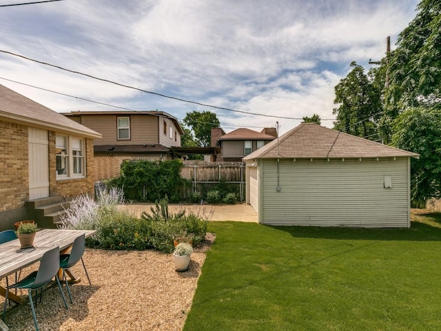 819 Clermont Ave, Dallas, TX 75223 - view of yard with a patio area, an outdoor structure, entry steps, and a detached garage