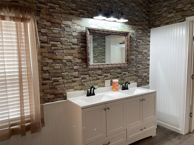 120 County Road 1719, Clifton, TX 76634 - full bathroom with double vanity and wood finished floors