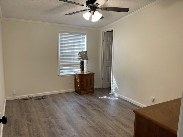 120 County Road 1719, Clifton, TX 76634 - empty room with a textured ceiling, ceiling fan, wood finished floors, crown molding, and baseboards
