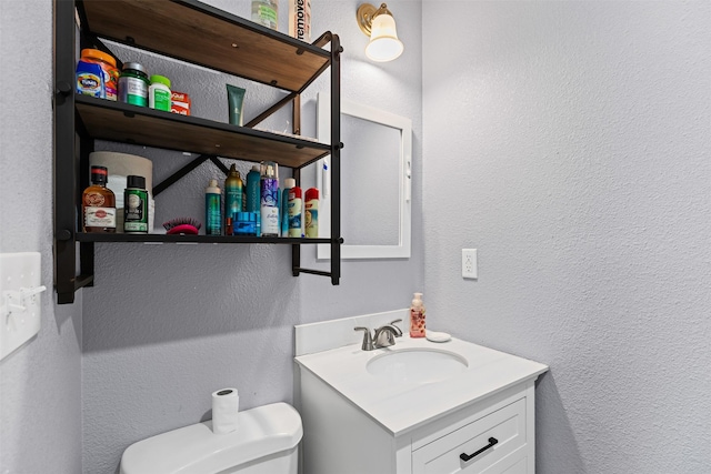 105 S Lavaca St, Whitney, TX 76692 - half bath with a textured wall, toilet, and vanity