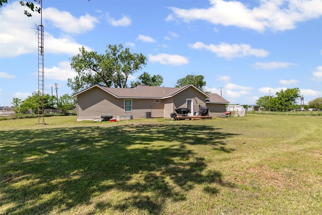 105 S Lavaca St, Whitney, TX 76692 - rear view of house featuring a lawn