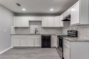 616 Hiland St, Garland, TX 75040 - kitchen with dishwasher, stainless steel electric stove, under cabinet range hood, tasteful backsplash, and white cabinetry