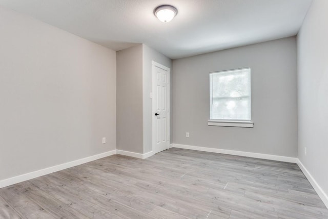 616 Hiland St, Garland, TX 75040 - spare room with light wood-style floors and baseboards