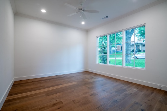9621 Larchcrest Dr, Dallas, TX 75238 - empty room with healthy amount of natural light, wood finished floors, ornamental molding, and recessed lighting