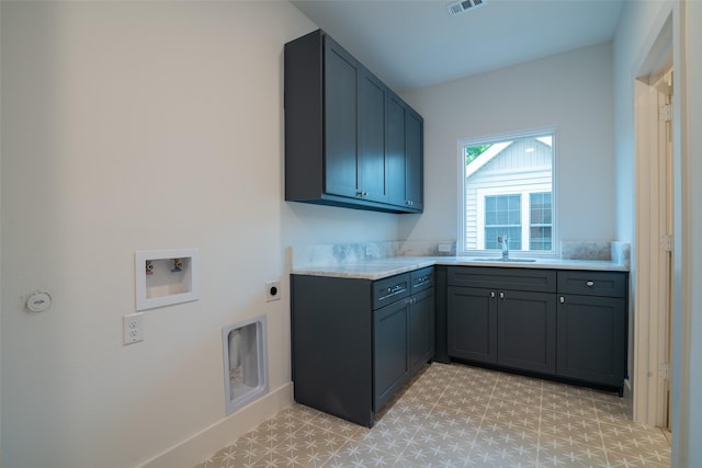 9621 Larchcrest Dr, Dallas, TX 75238 - laundry area featuring cabinet space, light flooring, hookup for a washing machine, and hookup for an electric dryer