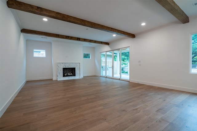 9621 Larchcrest Dr, Dallas, TX 75238 - unfurnished living room featuring beamed ceiling, a premium fireplace, wood finished floors, baseboards, and recessed lighting