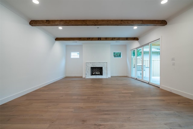 9621 Larchcrest Dr, Dallas, TX 75238 - unfurnished living room with a premium fireplace, beam ceiling, wood finished floors, baseboards, and recessed lighting