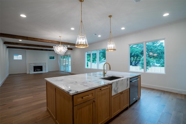 9621 Larchcrest Dr, Dallas, TX 75238 - kitchen featuring a sink, stainless steel dishwasher, dark wood finished floors, a high end fireplace, and light stone counters
