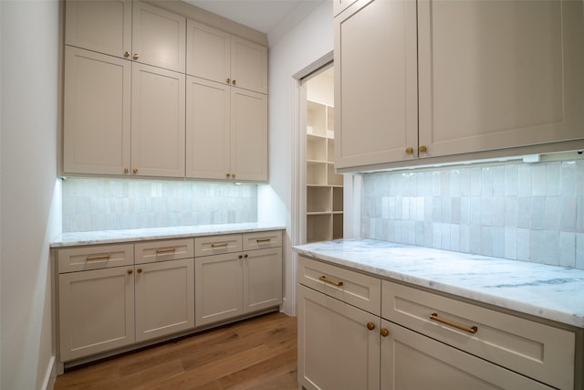 9621 Larchcrest Dr, Dallas, TX 75238 - kitchen featuring light wood-style floors, backsplash, and light stone countertops
