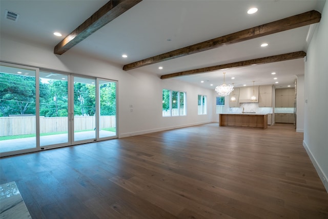 9621 Larchcrest Dr, Dallas, TX 75238 - unfurnished living room with beam ceiling, a chandelier, wood finished floors, baseboards, and recessed lighting