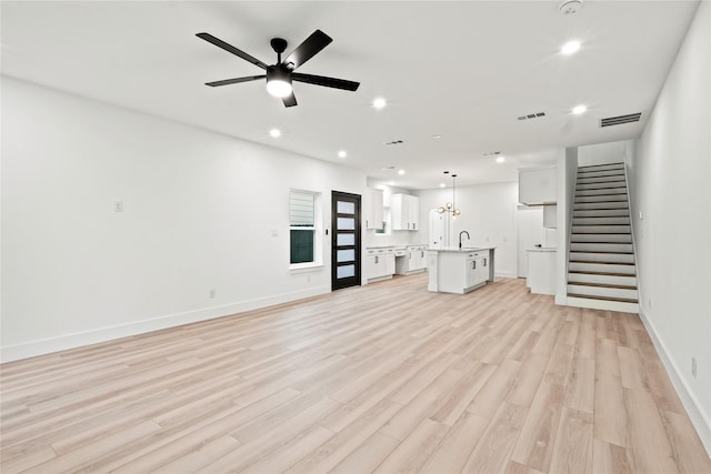 1312 Coleman Ave, Dallas, TX 75215 - unfurnished living room with recessed lighting, light wood-style flooring, stairs, baseboards, and a ceiling fan