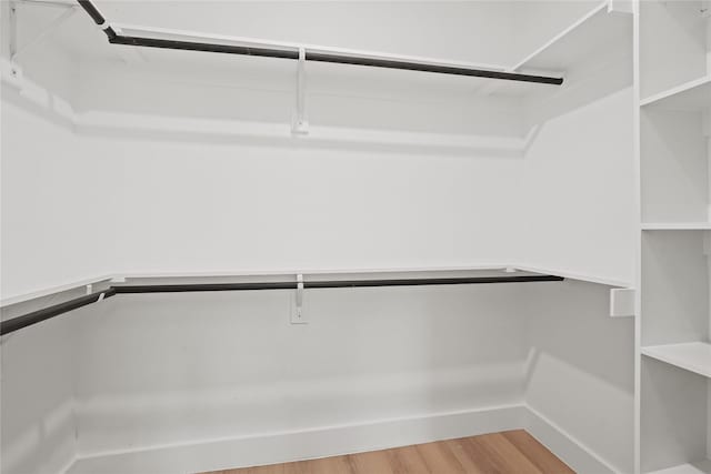 1312 Coleman Ave, Dallas, TX 75215 - walk in closet with wood finished floors