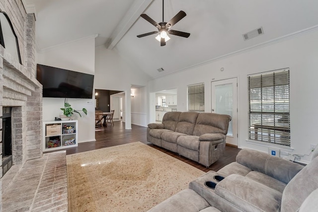 7020 Live Oak Dr, North Richland Hills, TX 76182 - living room featuring wood finished floors, a brick fireplace, a ceiling fan, beam ceiling, and high vaulted ceiling