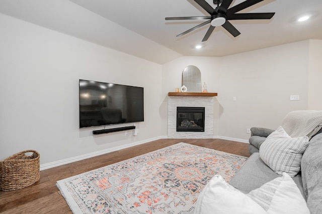 1519 Fairweather Way, Forney, TX 75126 - living room with ceiling fan, baseboards, wood finished floors, a glass covered fireplace, and vaulted ceiling