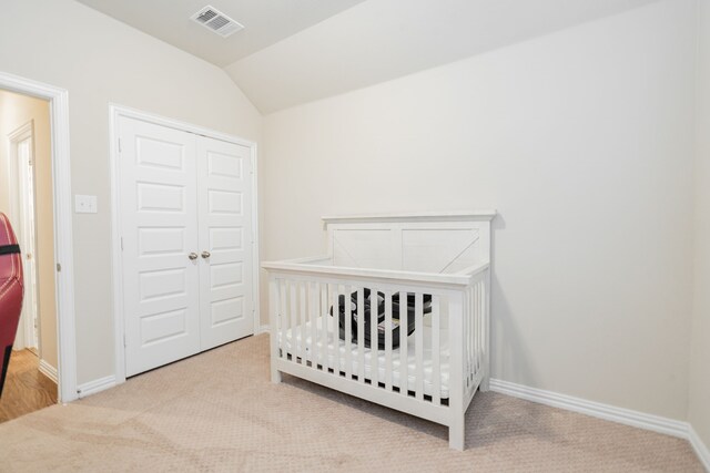 1519 Fairweather Way, Forney, TX 75126 - carpeted bedroom with a closet, vaulted ceiling, baseboards, and a crib