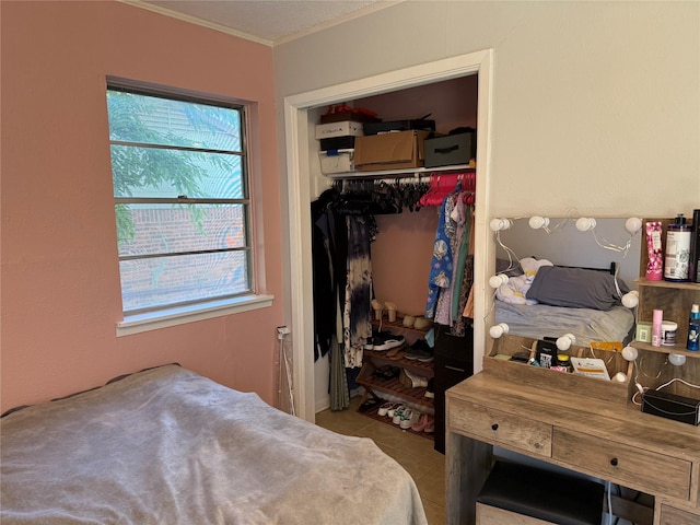 1403 Little St, Copperas Cove, TX 76522 - tiled bedroom featuring a closet and ornamental molding