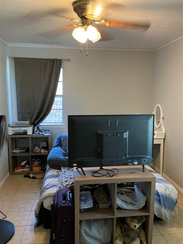 1403 Little St, Copperas Cove, TX 76522 - bedroom featuring light tile patterned floors, crown molding, ceiling fan, baseboards, and a textured ceiling