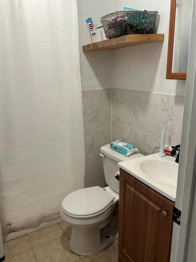 1403 Little St, Copperas Cove, TX 76522 - bathroom with toilet, vanity, tile walls, curtained shower, and tile patterned flooring