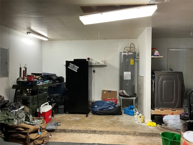 1403 Little St, Copperas Cove, TX 76522 - basement with electric water heater, electric panel, and freestanding refrigerator