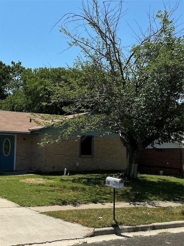 1403 Little St, Copperas Cove, TX 76522 - view of side of home featuring brick siding and a lawn