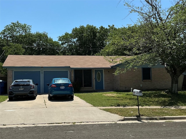 1403 Little St, Copperas Cove, TX 76522 - ranch-style home featuring concrete driveway, a garage, brick siding, and a front yard