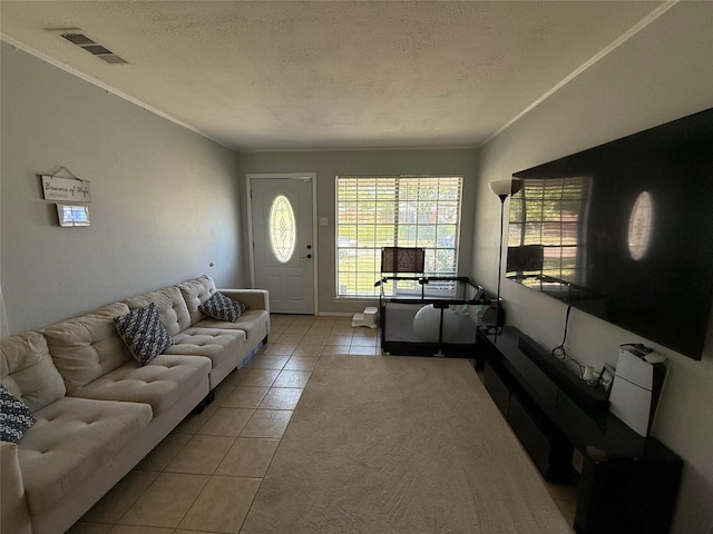 1403 Little St, Copperas Cove, TX 76522 - tiled living room featuring a textured ceiling, crown molding, and baseboards