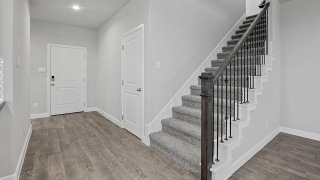 105 Leon Ave, Rhome, TX 76078 - foyer entrance featuring stairs, wood finished floors, and baseboards