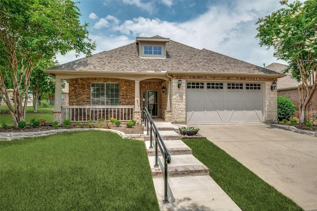 382 Burnswick Isles Way, Frisco, TX 75036 - view of front of house with concrete driveway, a shingled roof, an attached garage, a front yard, and covered porch