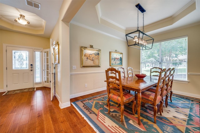 382 Burnswick Isles Way, Frisco, TX 75036 - dining area featuring a tray ceiling, a chandelier, wood-type flooring, ornamental molding, and baseboards