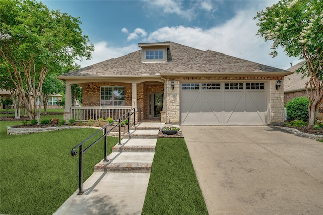 382 Burnswick Isles Way, Frisco, TX 75036 - view of front of house featuring concrete driveway, roof with shingles, a front yard, a garage, and covered porch