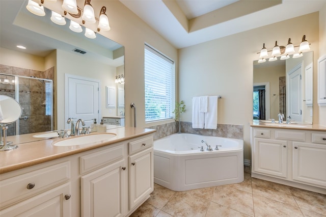 382 Burnswick Isles Way, Frisco, TX 75036 - bathroom featuring a stall shower, tile patterned flooring, a bath, two vanities, and a tray ceiling