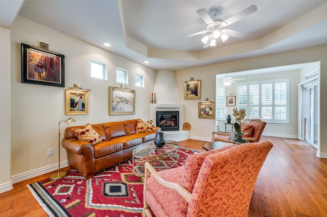 382 Burnswick Isles Way, Frisco, TX 75036 - living room with recessed lighting, wood finished floors, a ceiling fan, plenty of natural light, and a tray ceiling