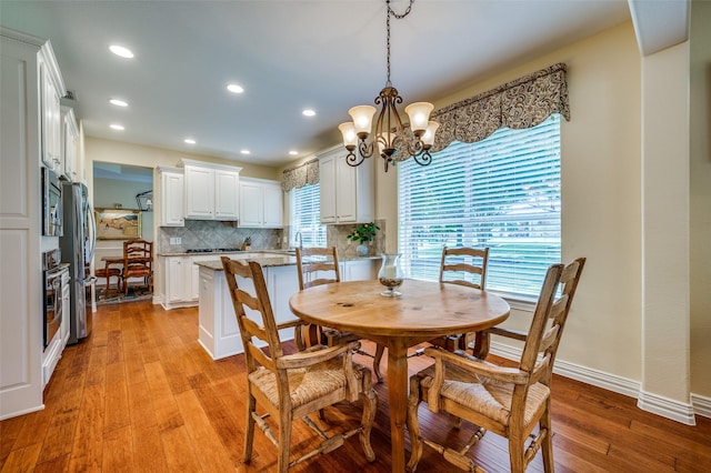 382 Burnswick Isles Way, Frisco, TX 75036 - dining space featuring light wood-style floors, plenty of natural light, recessed lighting, a chandelier, and baseboards