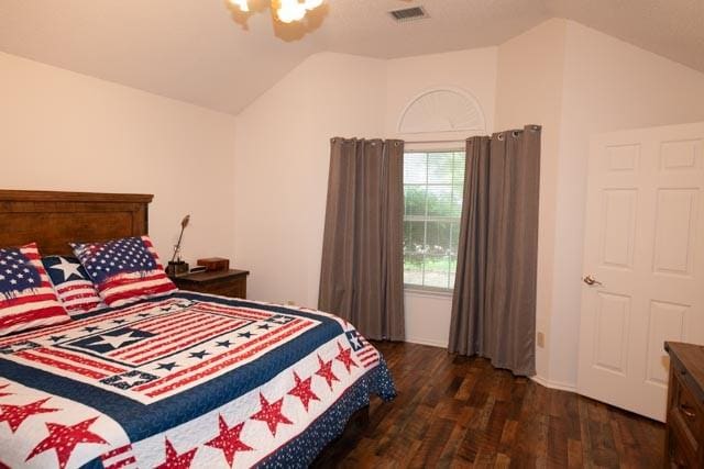 1111 Bayshore St, Allen, TX 75002 - bedroom with vaulted ceiling and dark wood-style flooring