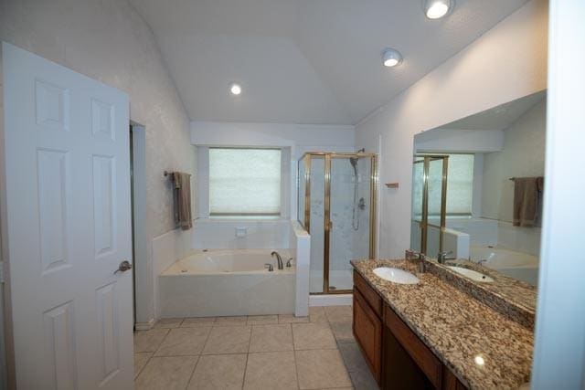 1111 Bayshore St, Allen, TX 75002 - full bath with vaulted ceiling, a stall shower, vanity, a garden tub, and tile patterned floors