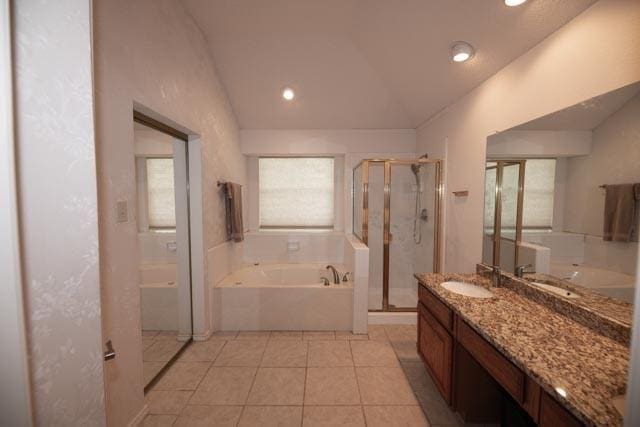 1111 Bayshore St, Allen, TX 75002 - full bathroom with lofted ceiling, a bath, a stall shower, vanity, and tile patterned floors